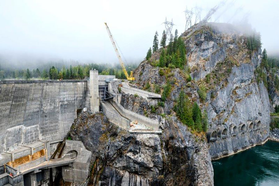 Broad view of the Boundary Dam spillway modification project in which the spillway is built into rock 275 feet above the Pend Oreille River in Washington