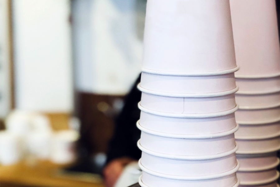 Two stacks of white paper cups